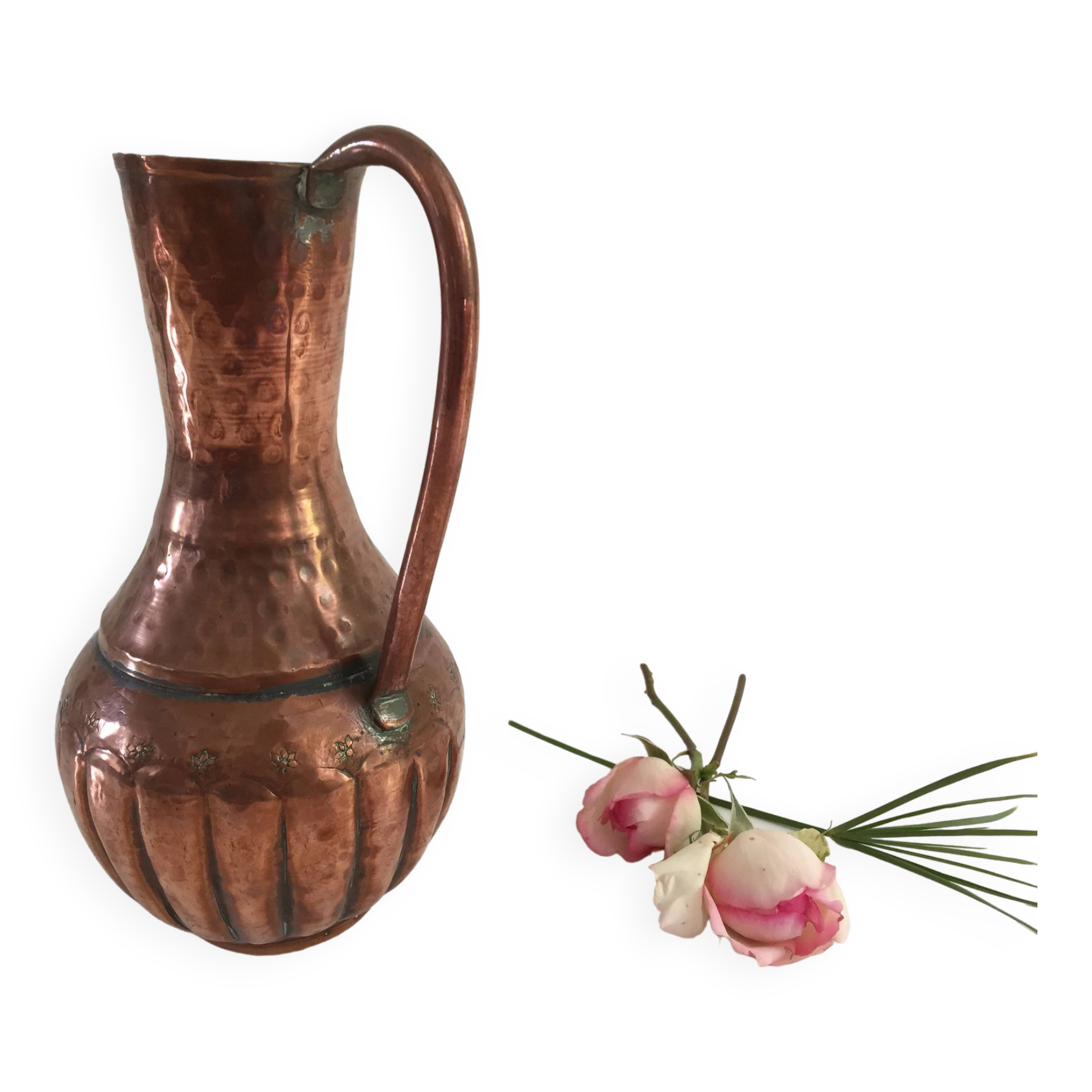 Pitcher-shaped vase in hammered copper