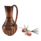 Pitcher-shaped vase in hammered copper
