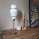 Mid-century gold metal table lamp with white striped shade