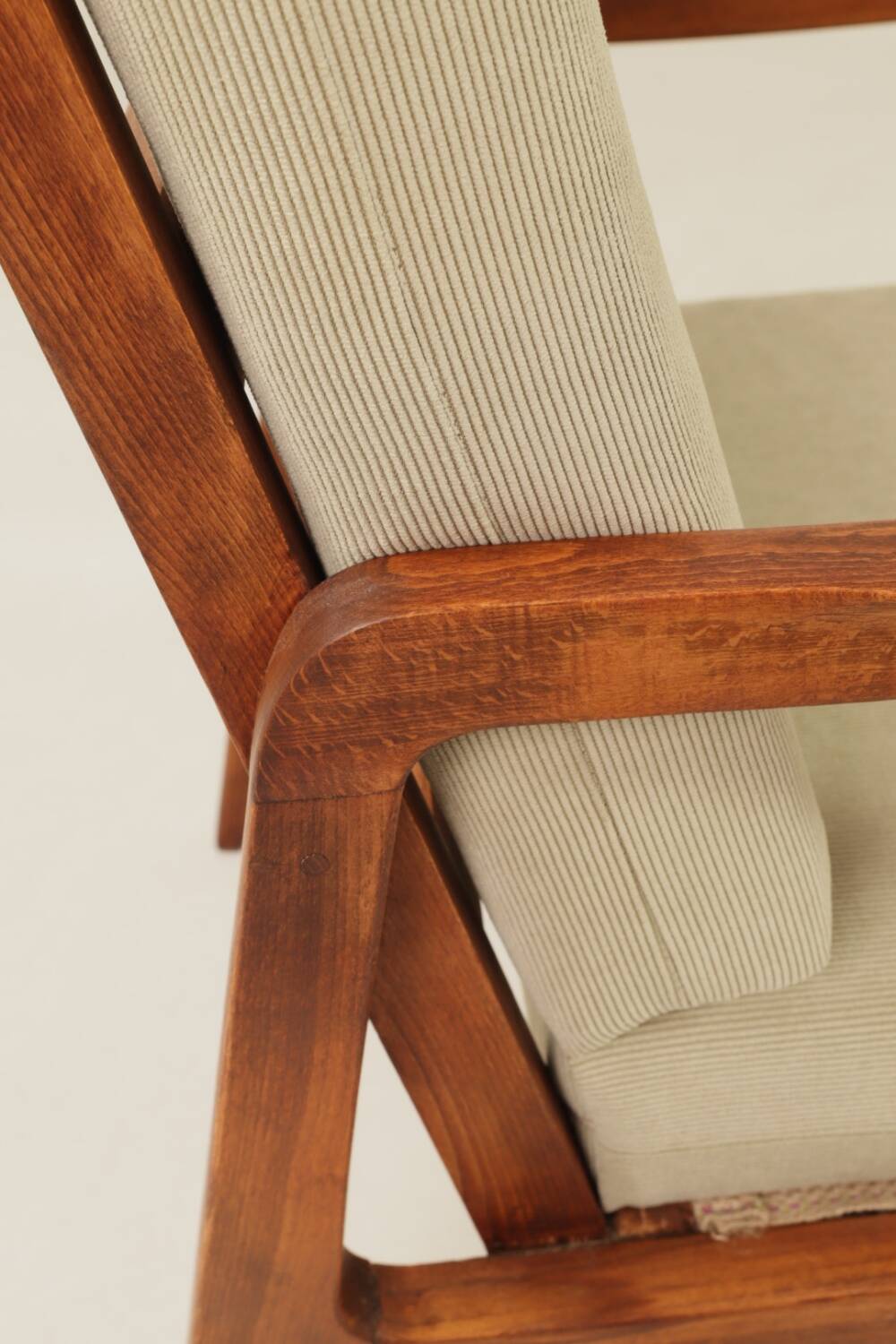 Vintage armchair in olive corduroy with a wooden frame.