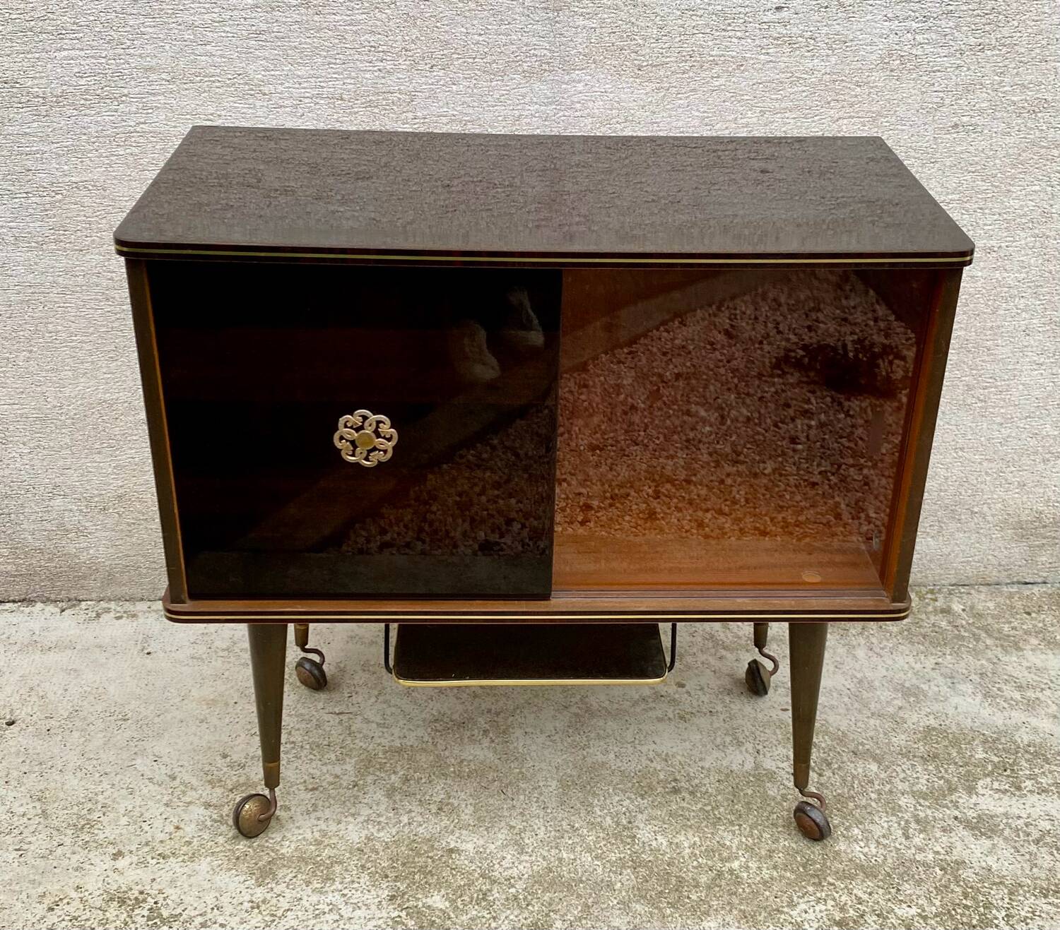 Vintage display bar cabinet on wheels from the 60s/70s.