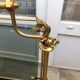 Revised door in brass and smoked glass