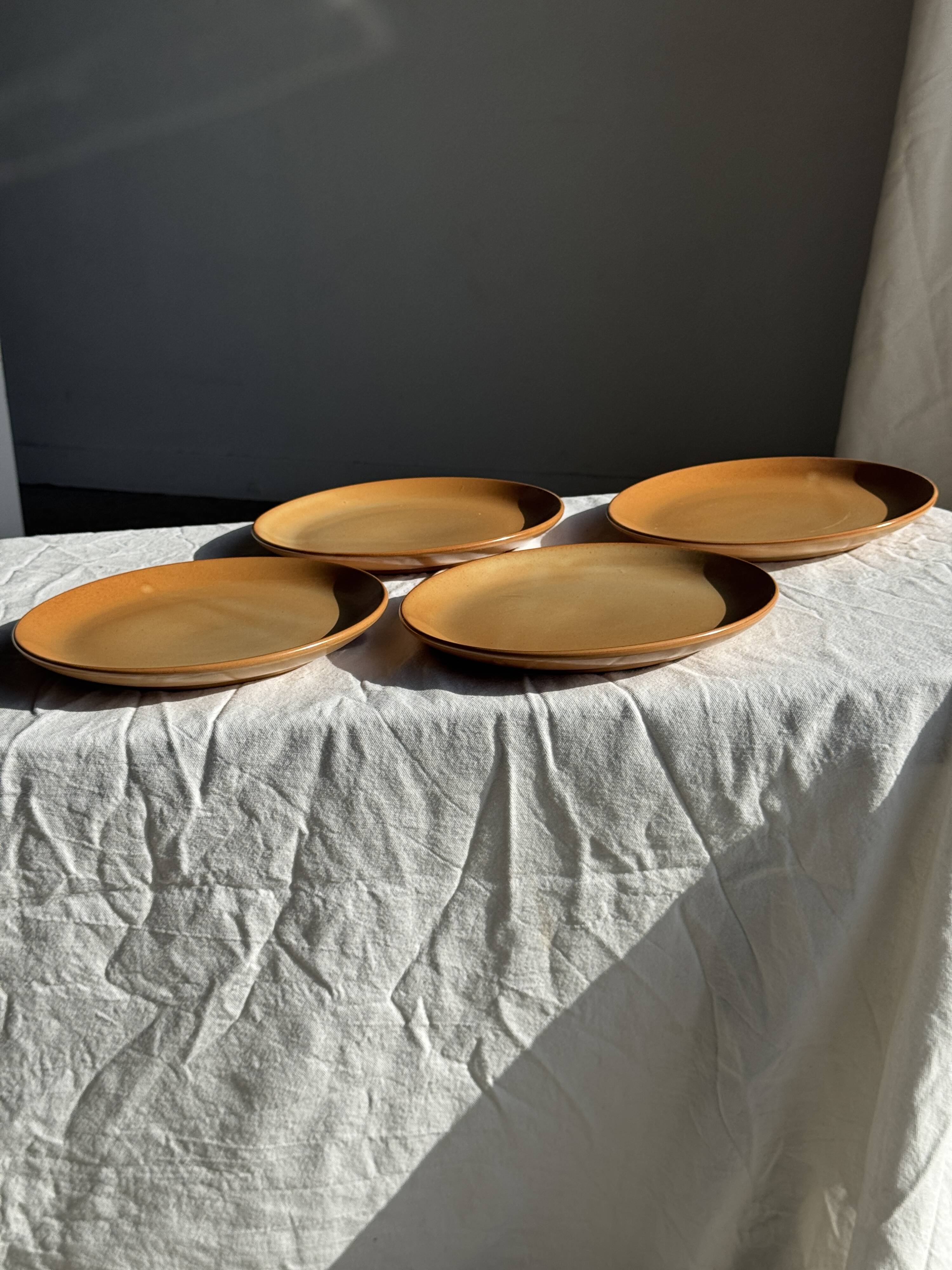 Set of 4 flat dinner plates in stoneware, no brand underneath.