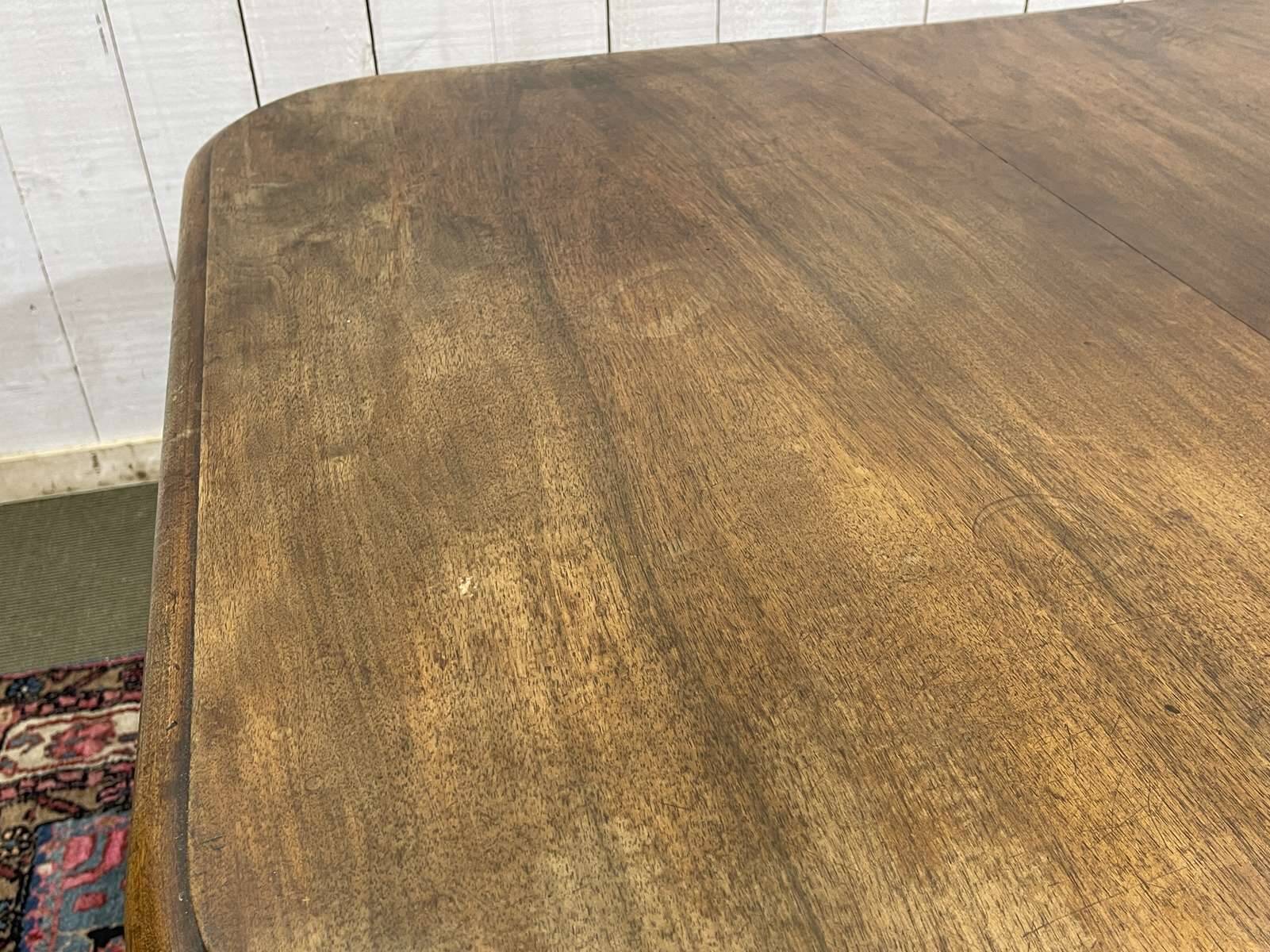 Henri II walnut table from the early 20th century with extensions.