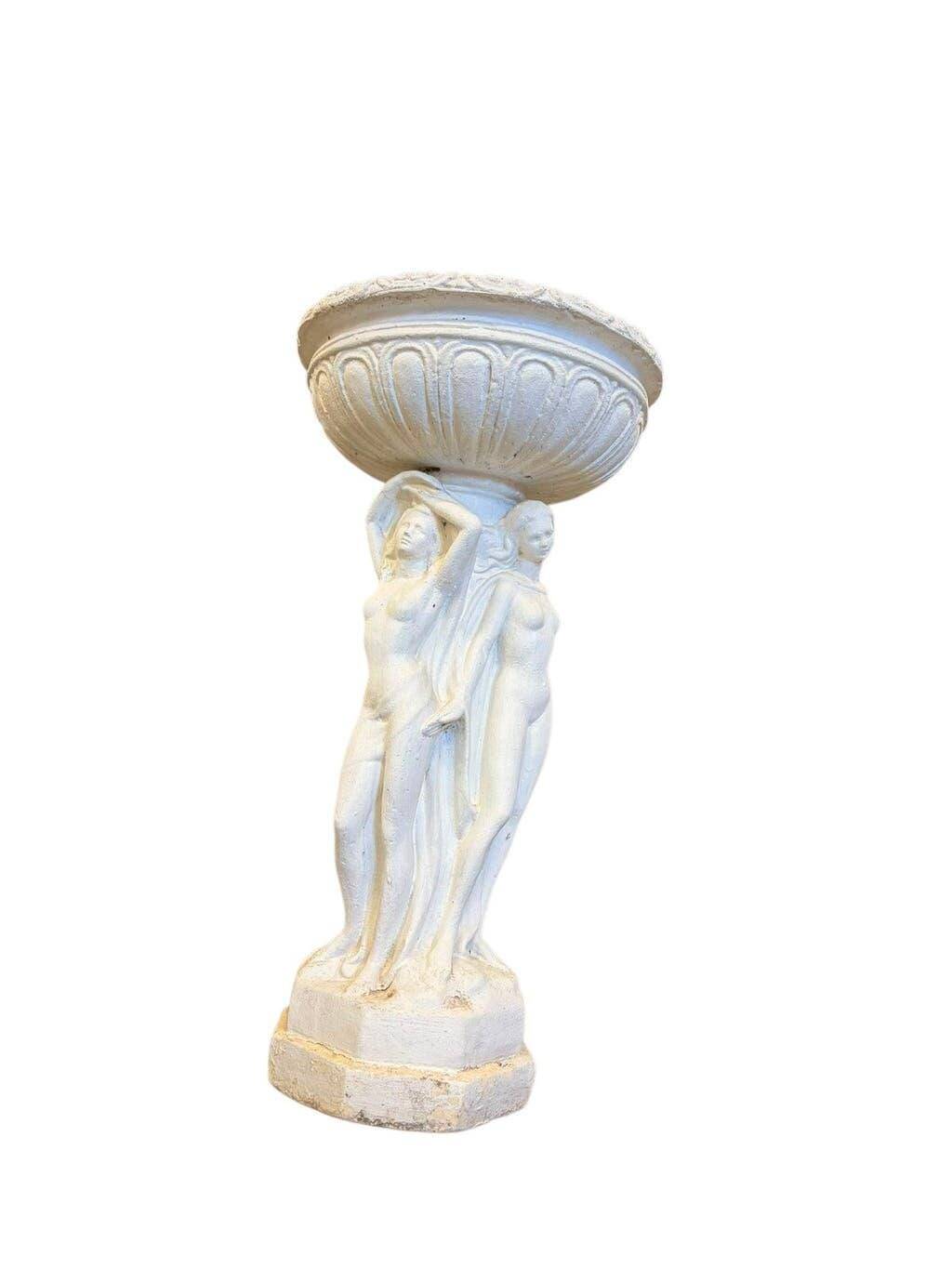Vintage white concrete garden statue adorned with planter.