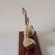 Duo of brass swans on base