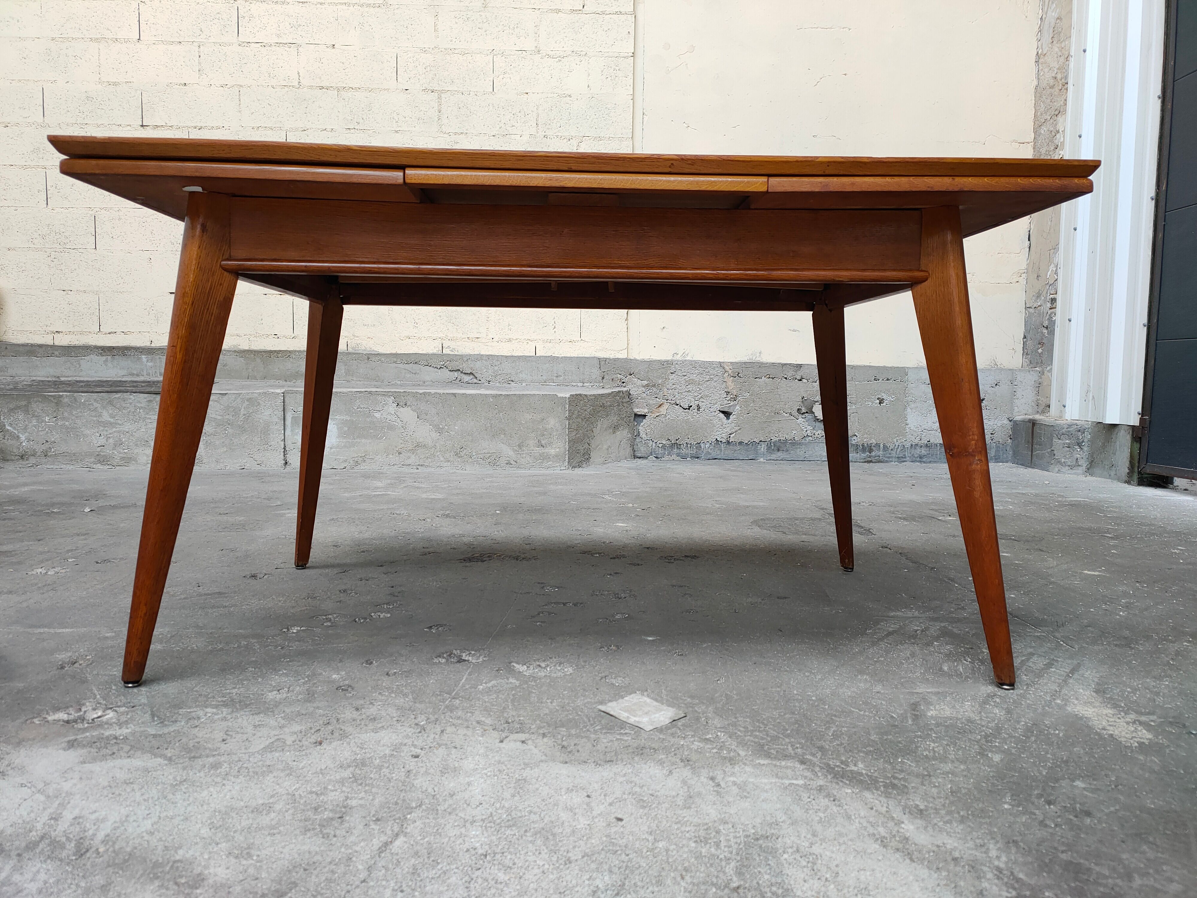 Dining table with oak compass legs