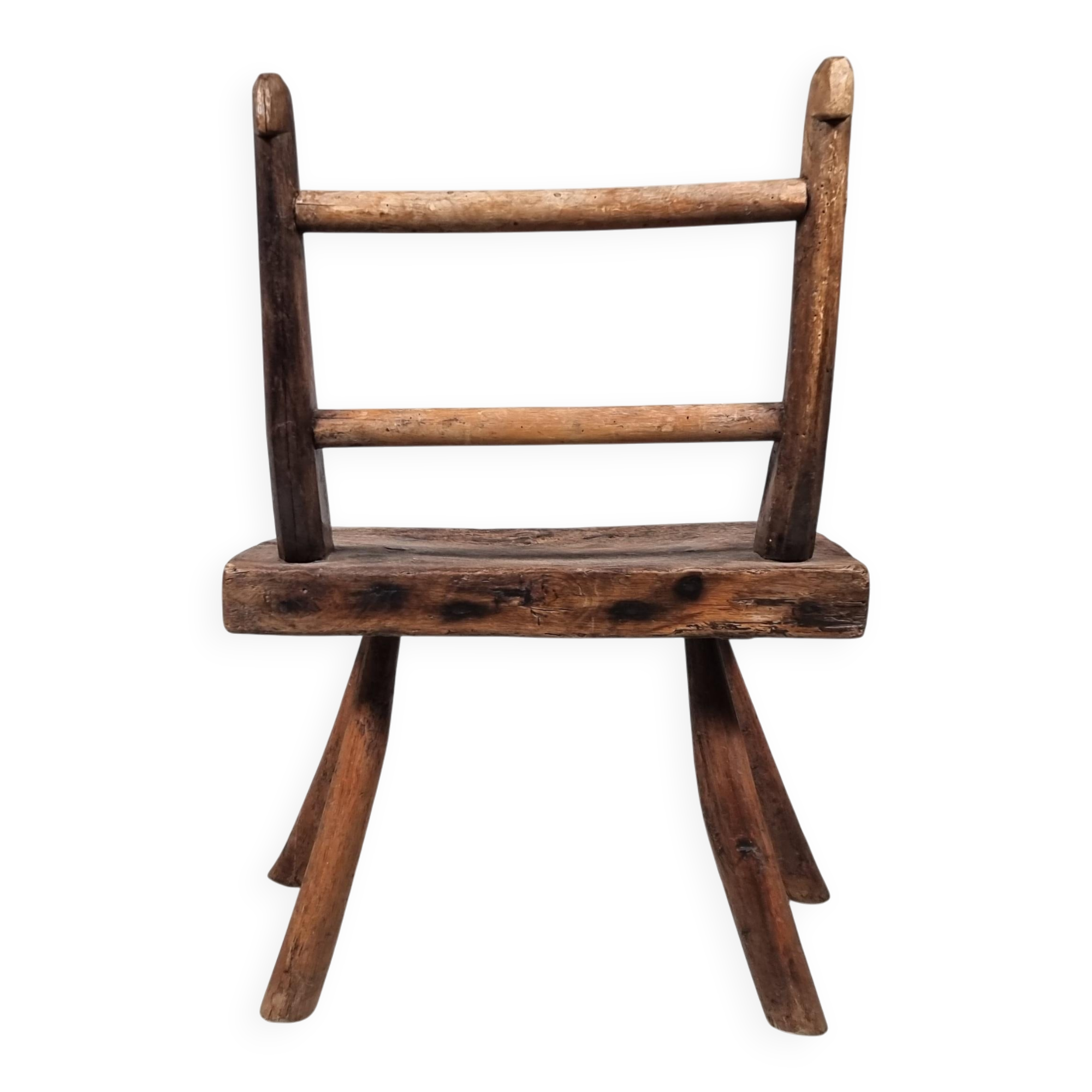 Rustic Wabi-Sabi style accent chair in dark curved hardwood, 1900s.