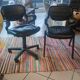 Two black leather armchairs