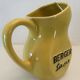 Old yellow pitcher anisette berger syrups, vintage bistro decoration