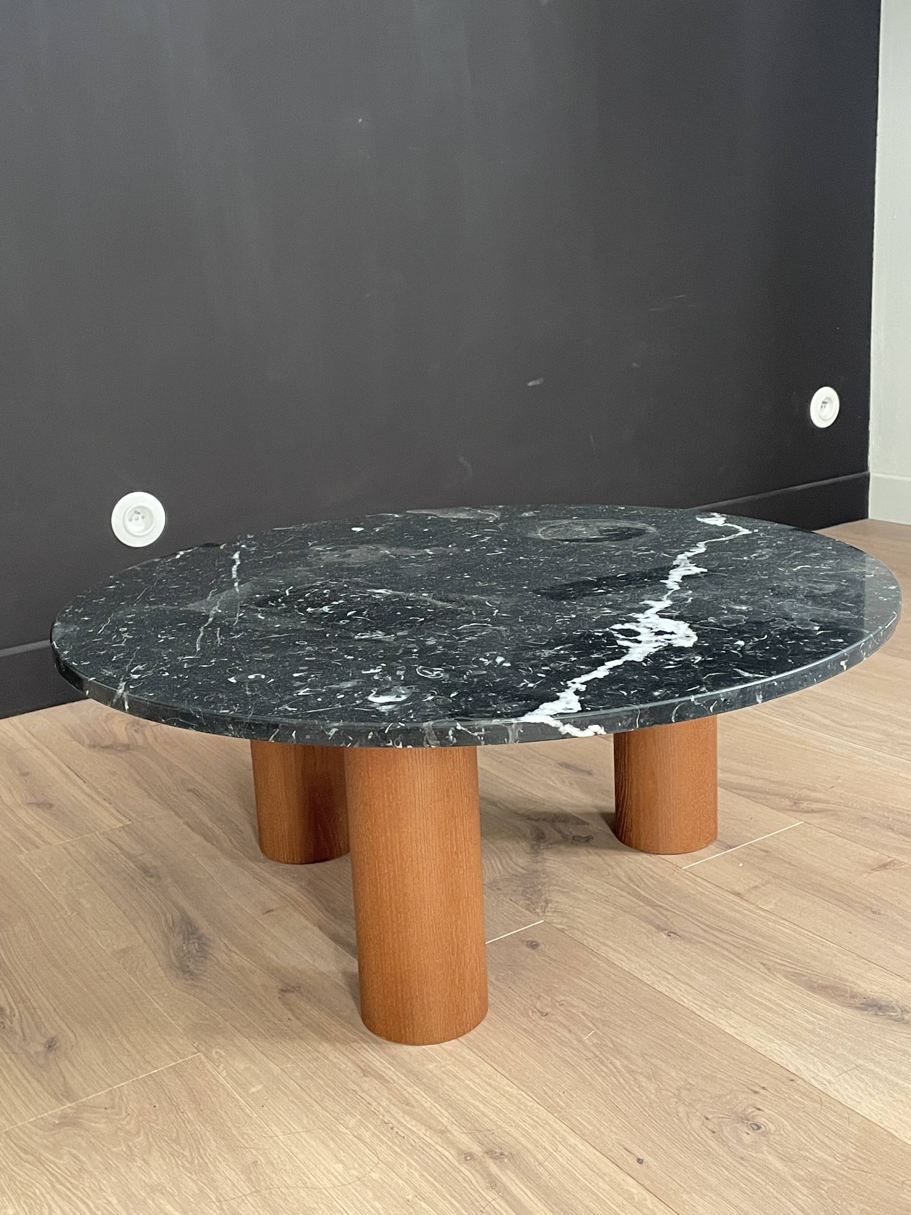 Black marble coffee table with wooden legs