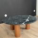 Black marble coffee table with wooden legs