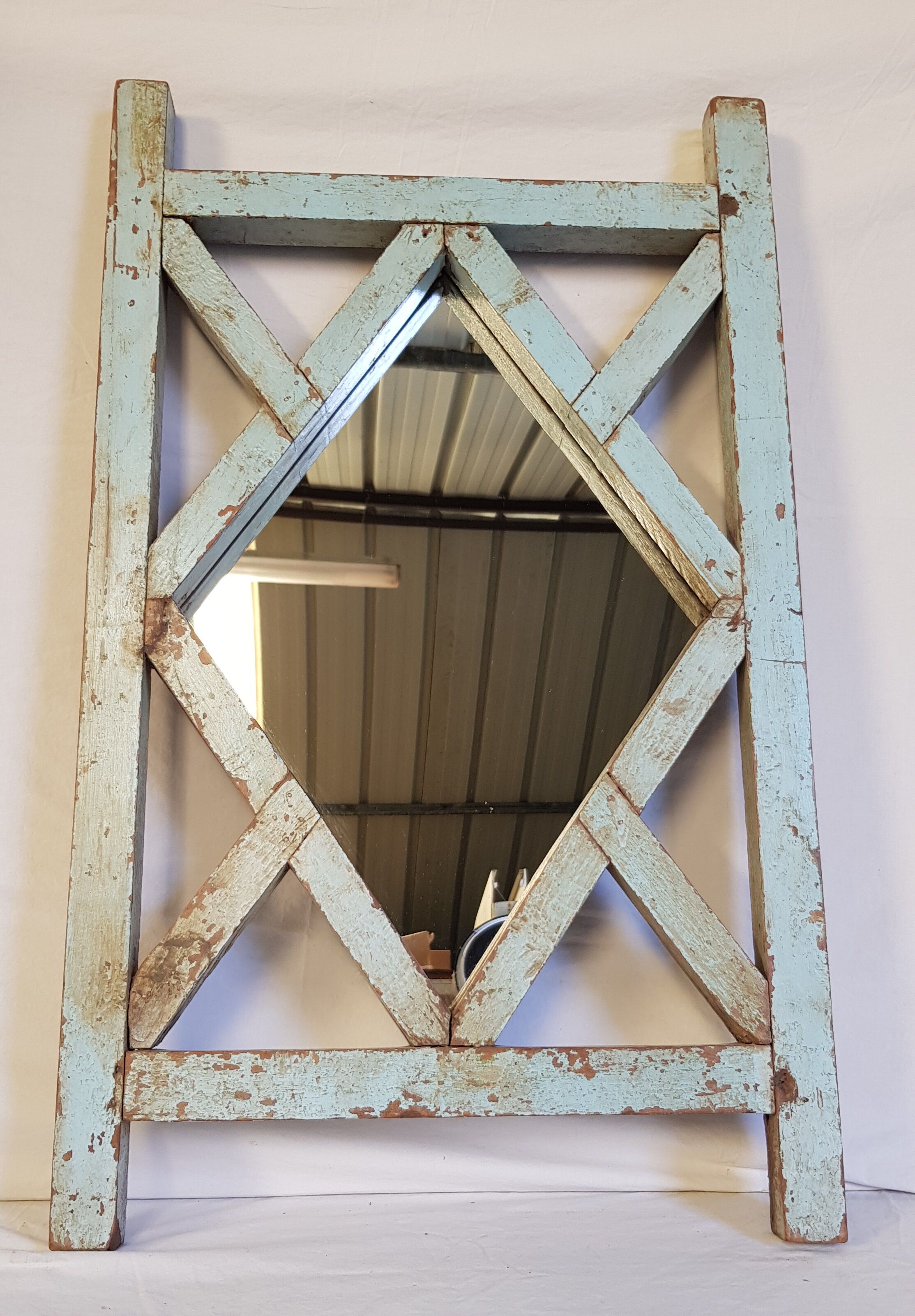 Old mirror claustras in Burmese teak