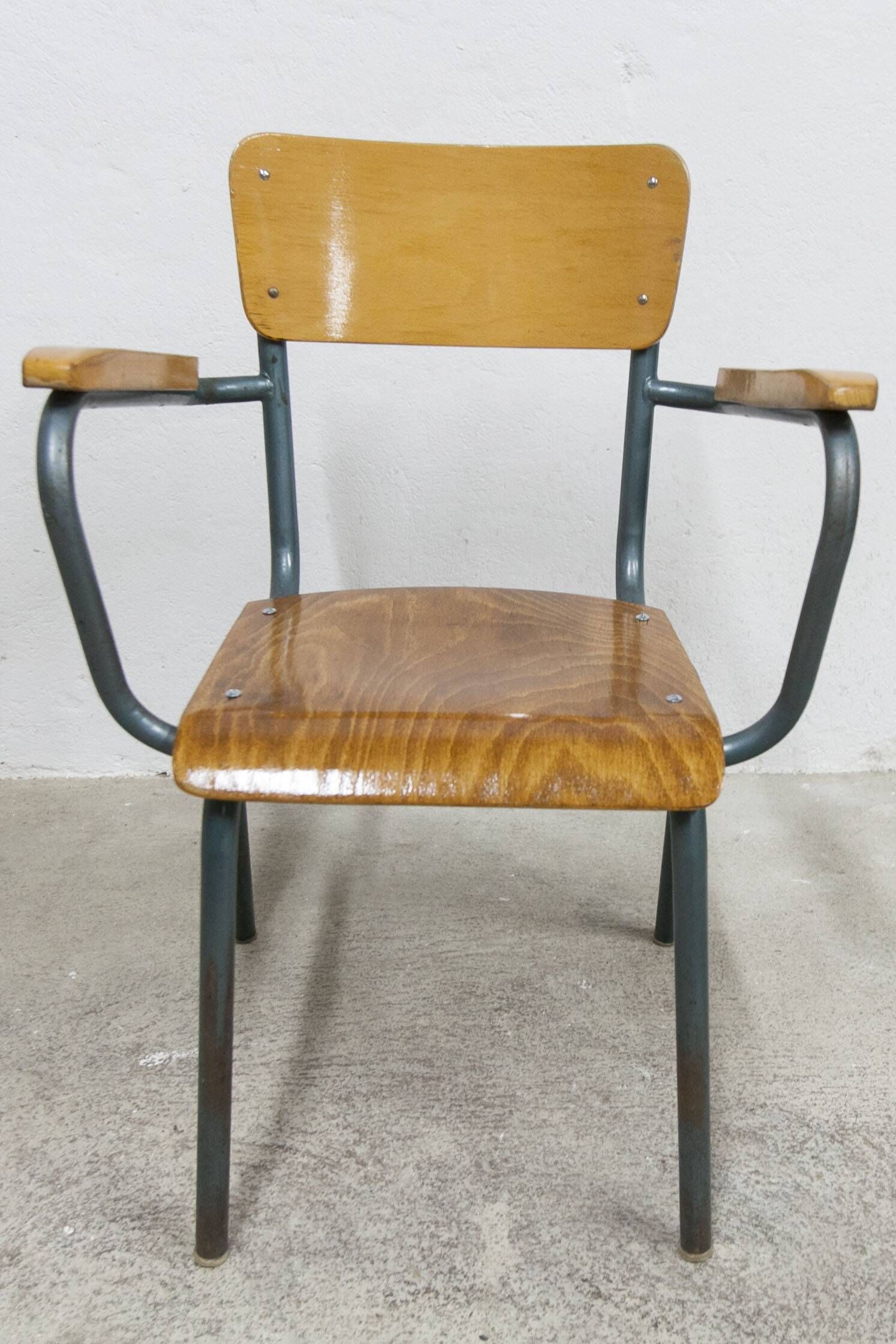 1962 school teacher's chair in honey color and tubular structure