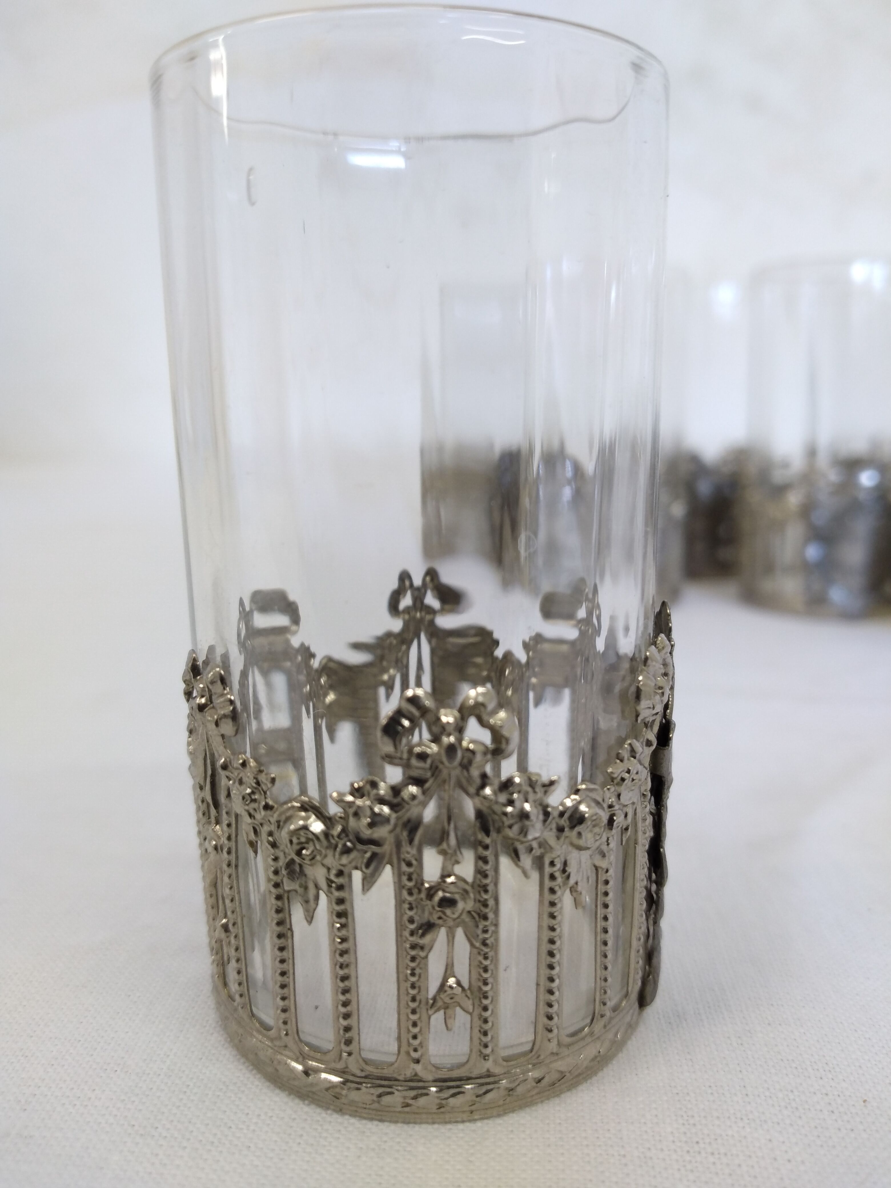 Glass with art deco strapping