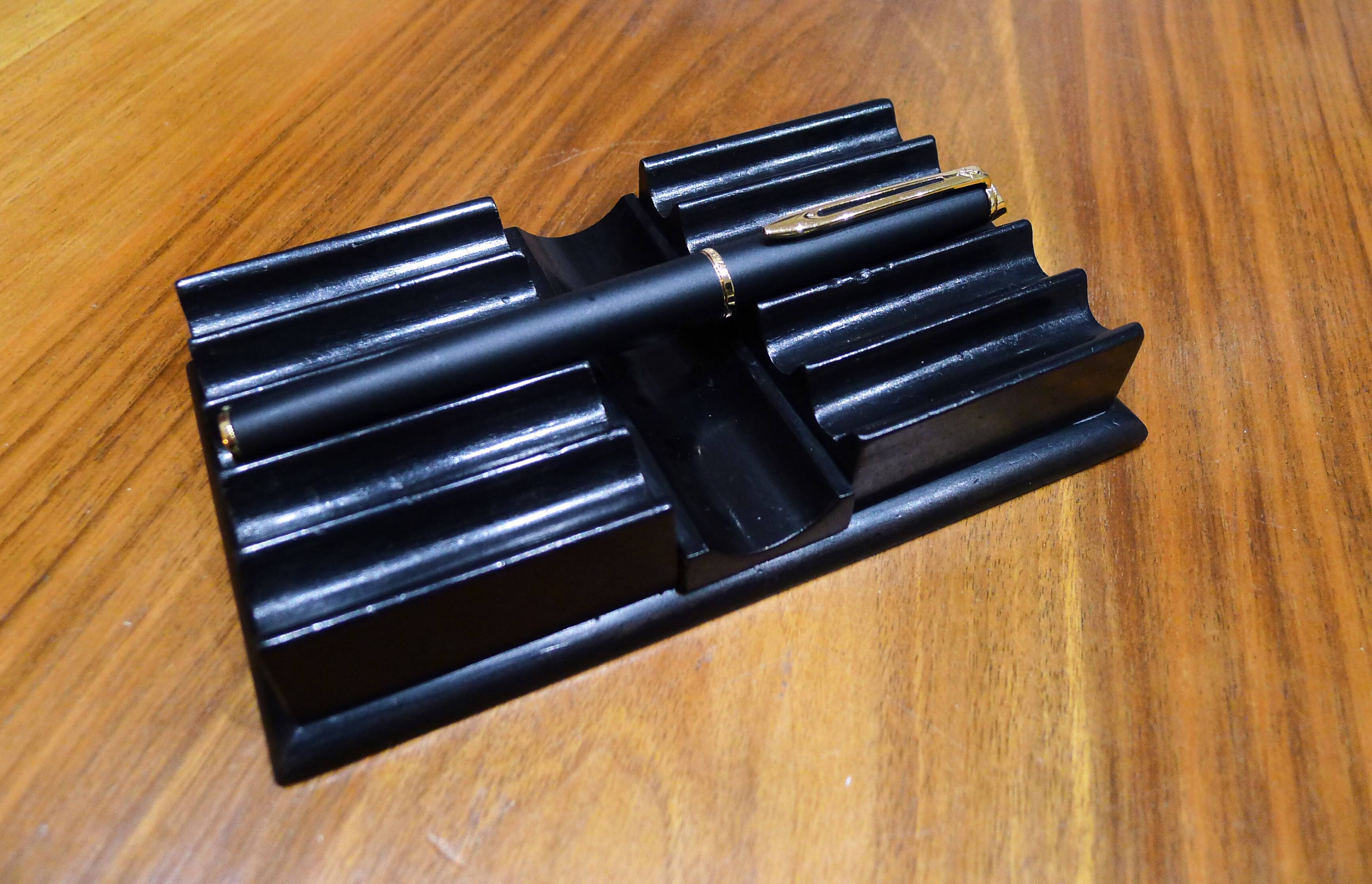 Old pen holder in black wood