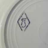 8 hollow plates in F J earthenware with frieze and central bouquet