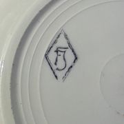 8 hollow plates in F J earthenware with frieze and central bouquet