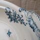 Shallow round plate Boch Frères model Regent with arabesque and foliage decoration.