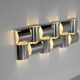Contemporary wall light in stainless steel and metal.