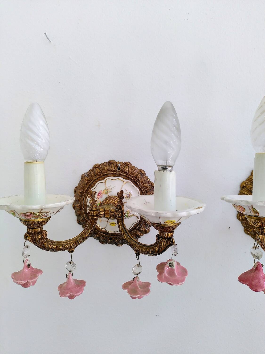 Pair of brass and porcelain wall lights