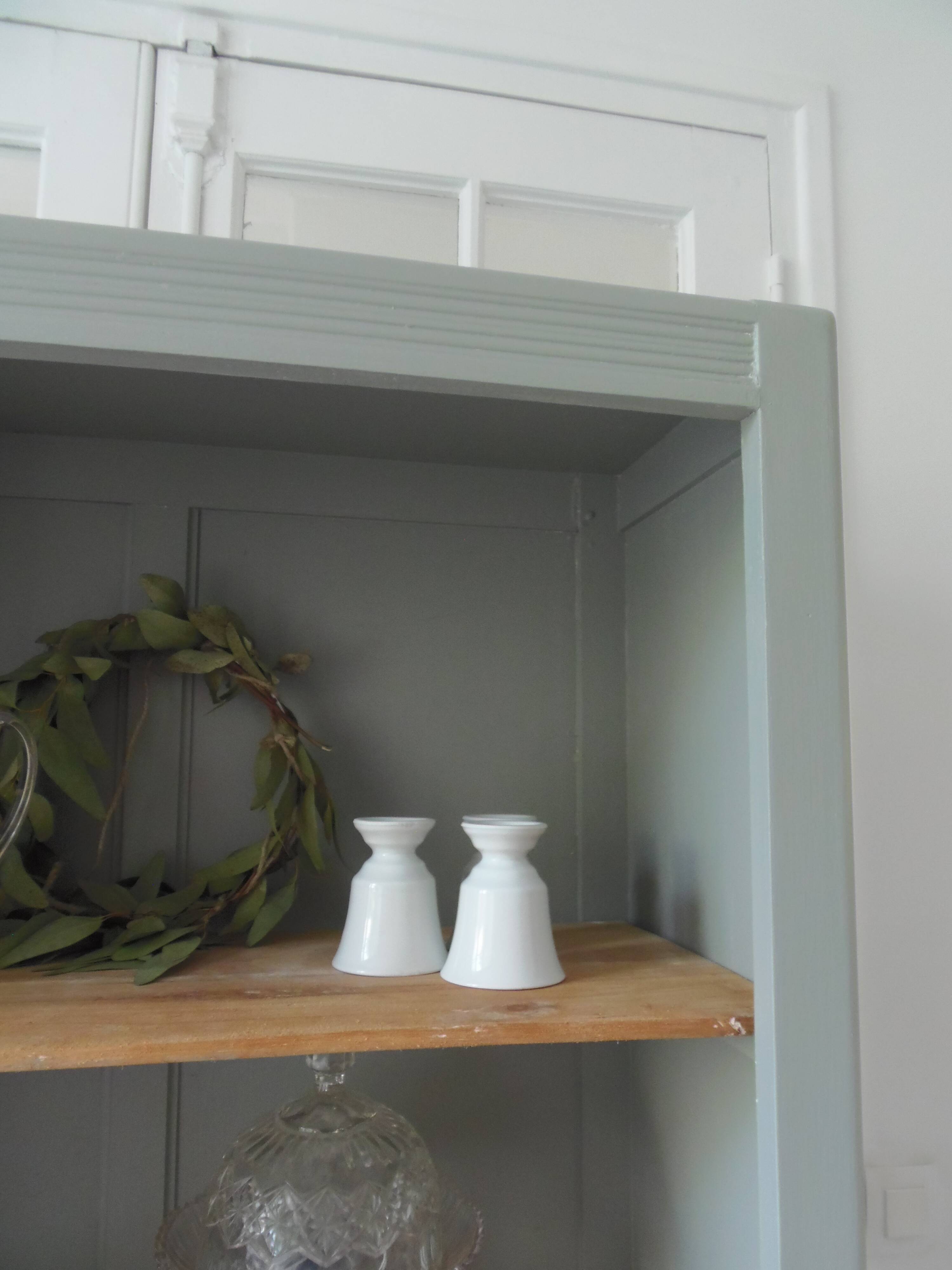 Vintage shallow bookcase re-enchanted in verdigris.