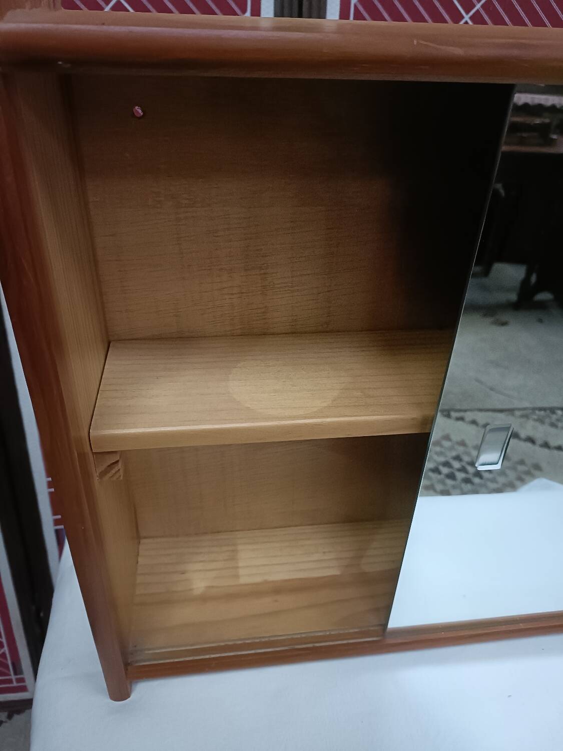 Small wall-mounted bathroom cabinet with vintage mirror doors