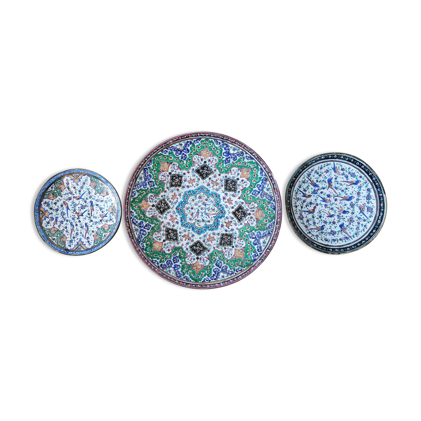 Plate and two decorative saucers enamelled with Persia decoration, circa 1940