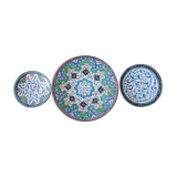 Plate and two decorative saucers enamelled with Persia decoration, circa 1940