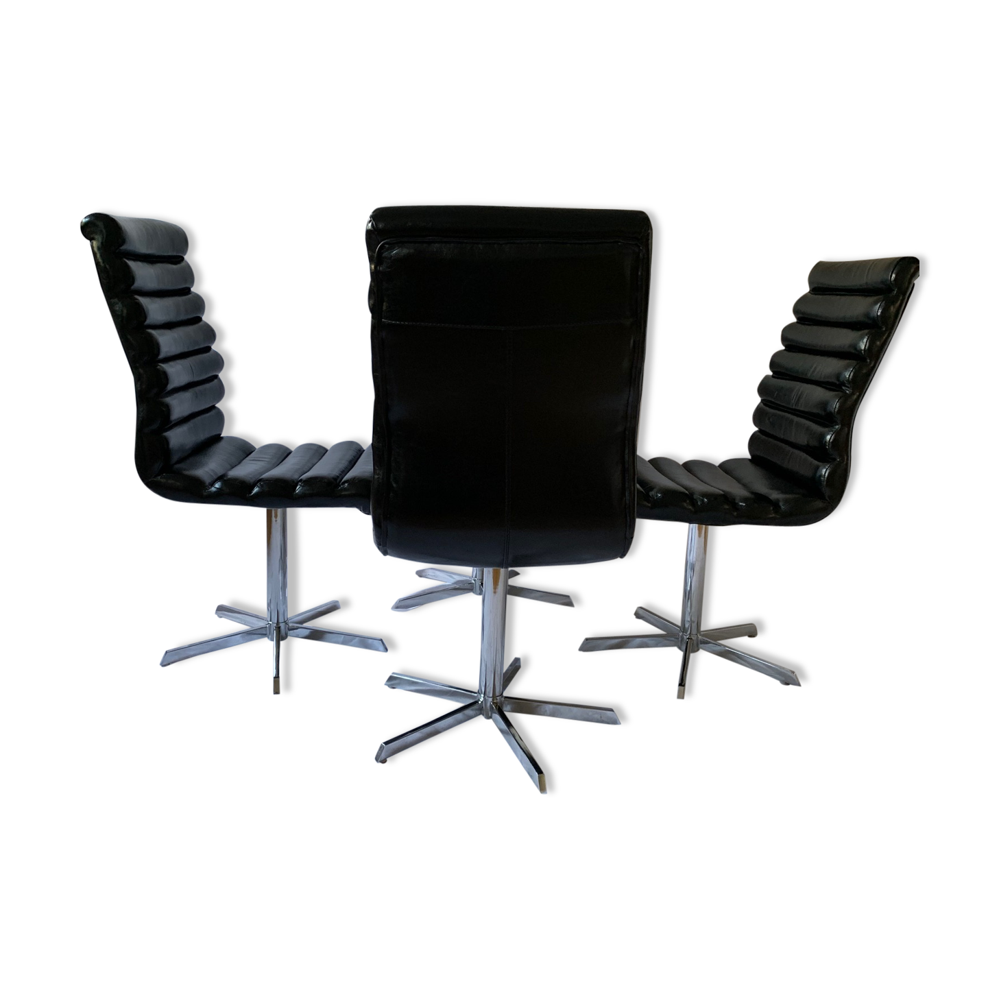 A set of four leather chairs, Italy, 80s
