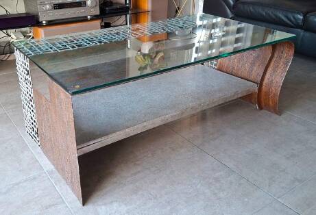 Metal coffee table with a glass top.