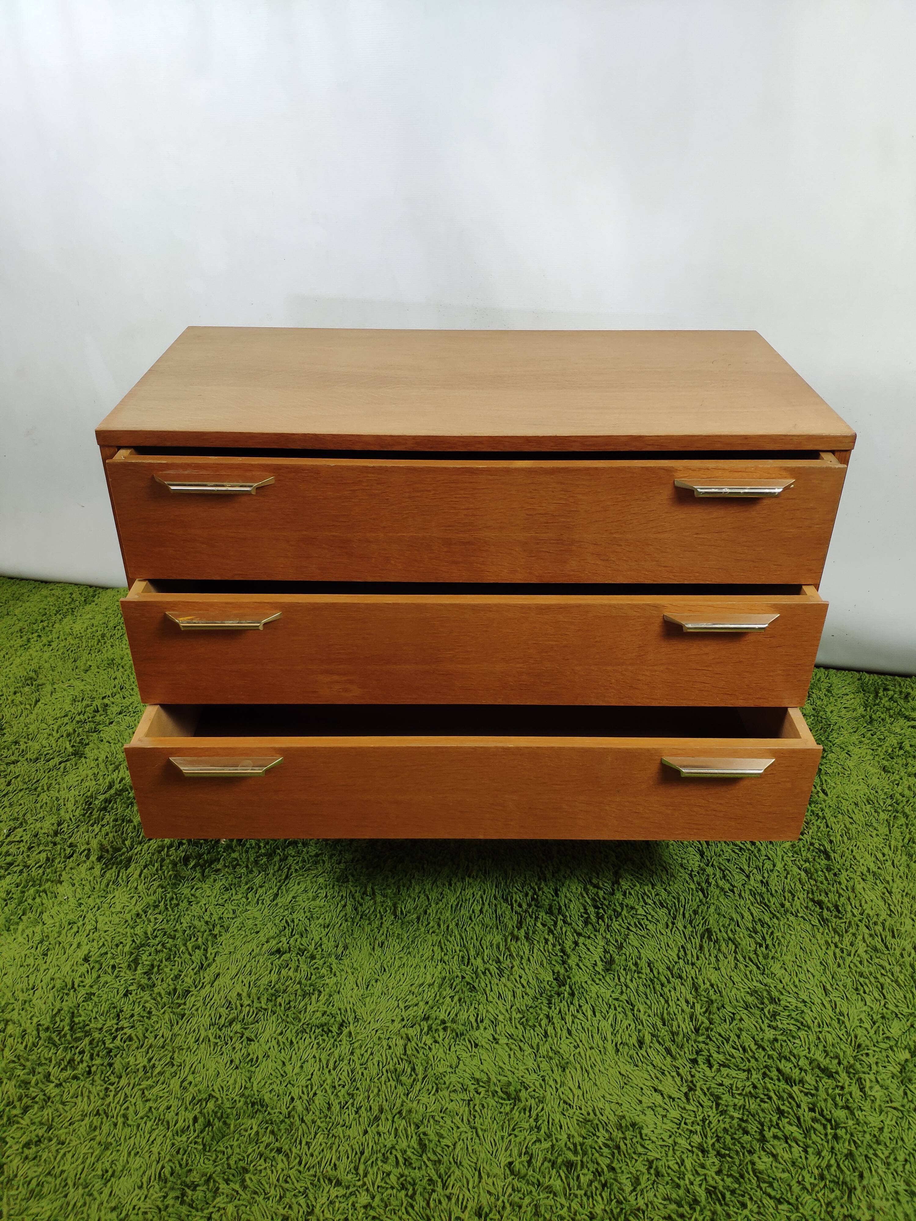 Wooden chest of drawers with gilded handle