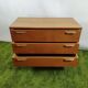 Wooden chest of drawers with gilded handle