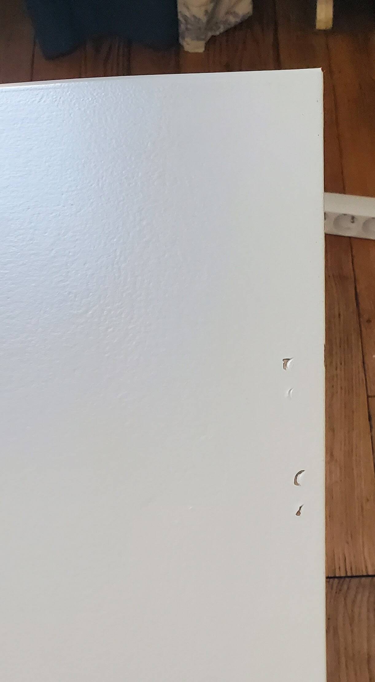 Dresser repainted in off-white and grey-pink colours.