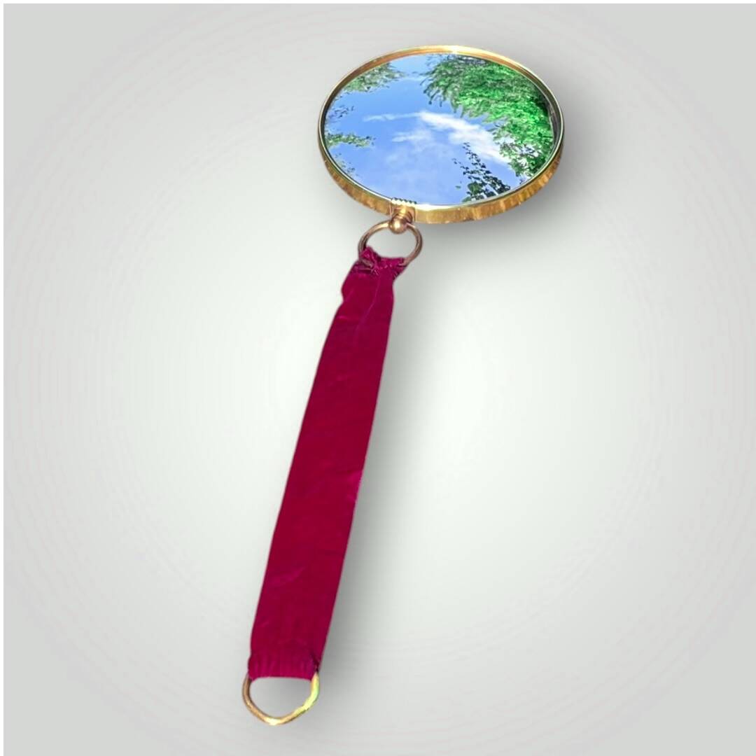 Antique convex "witch's eye" mirror