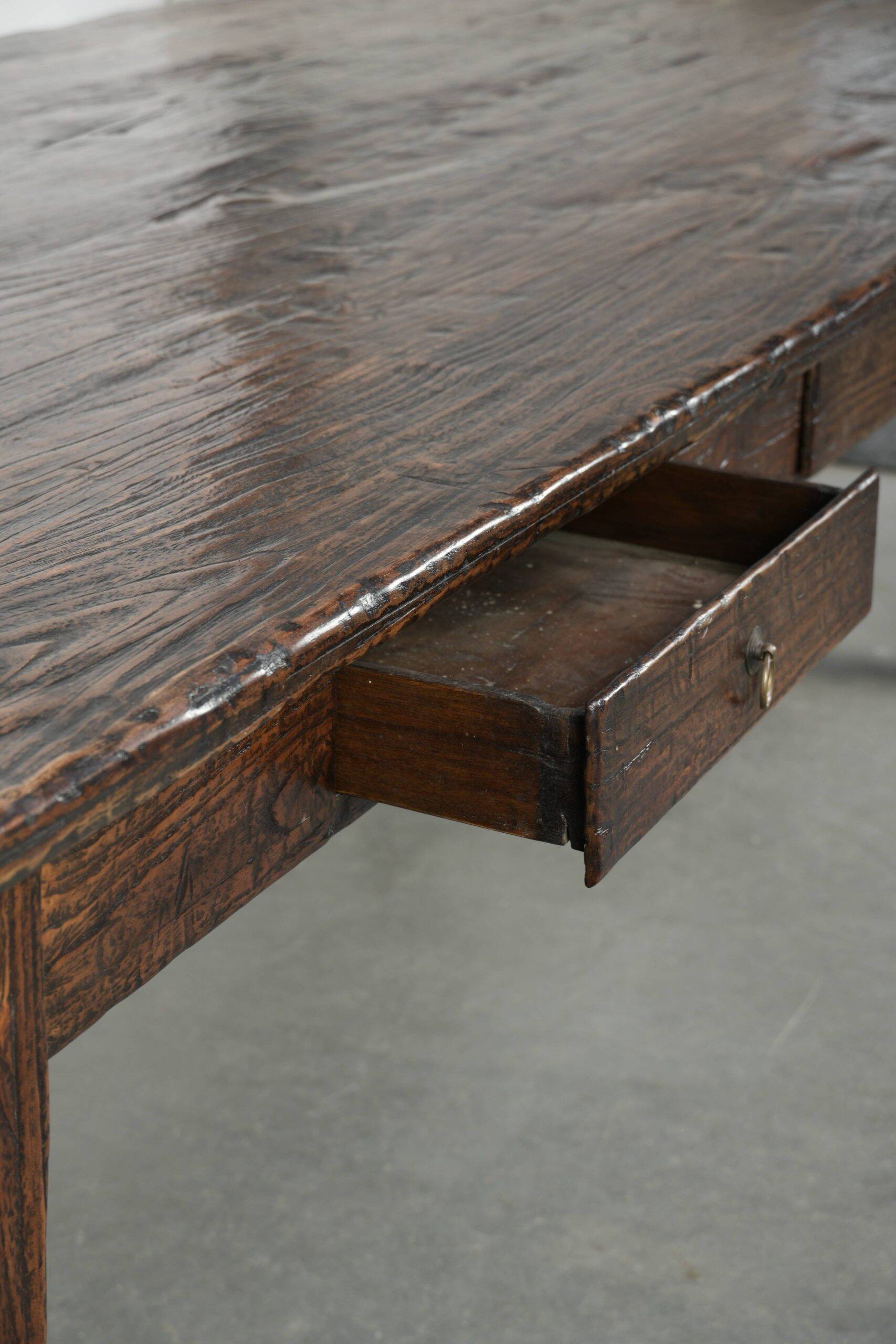 Large rustic dining table made of atmospheric elm wood with fine details