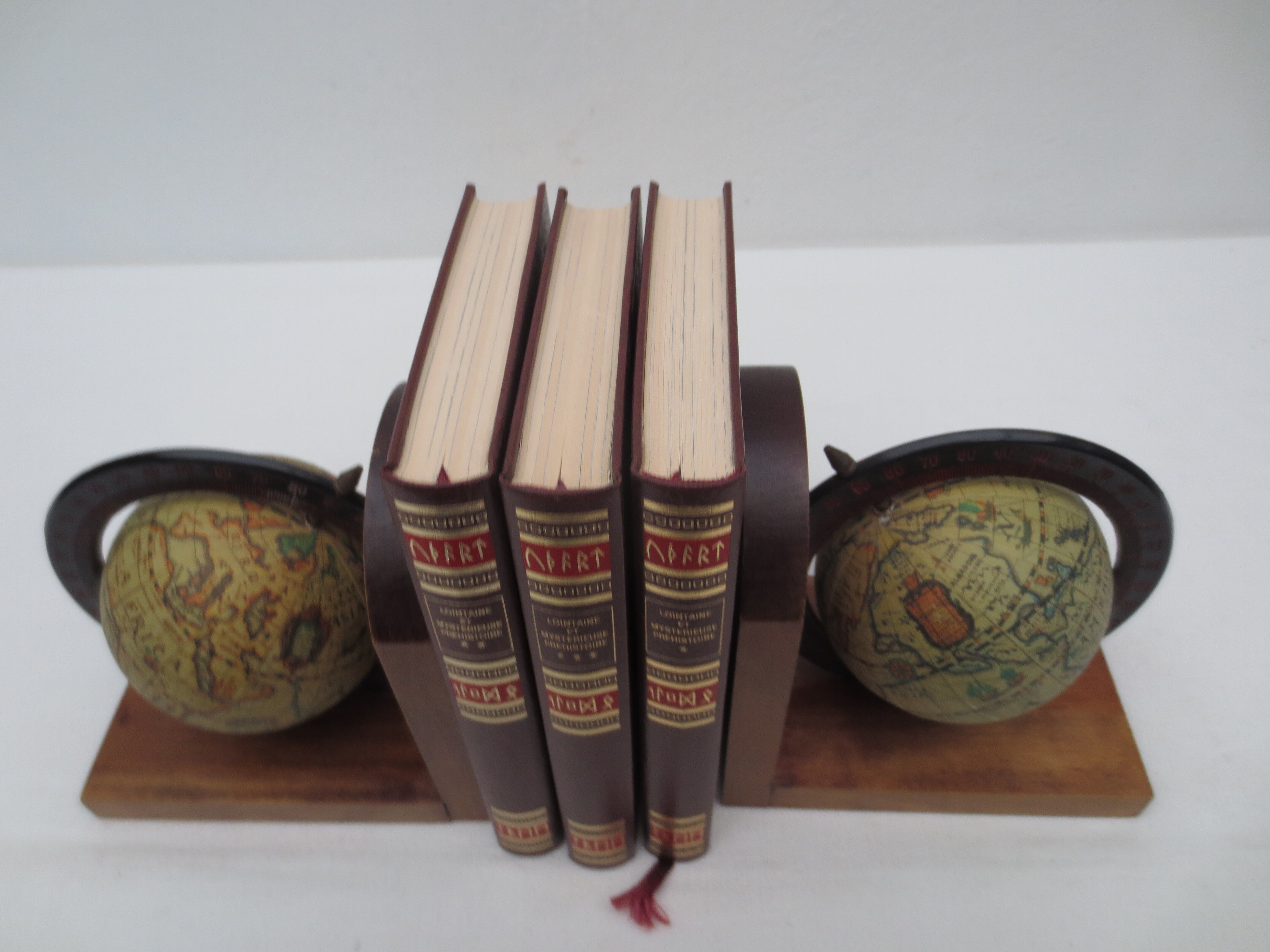 Old pair of greenhouse books in solid wood and world map