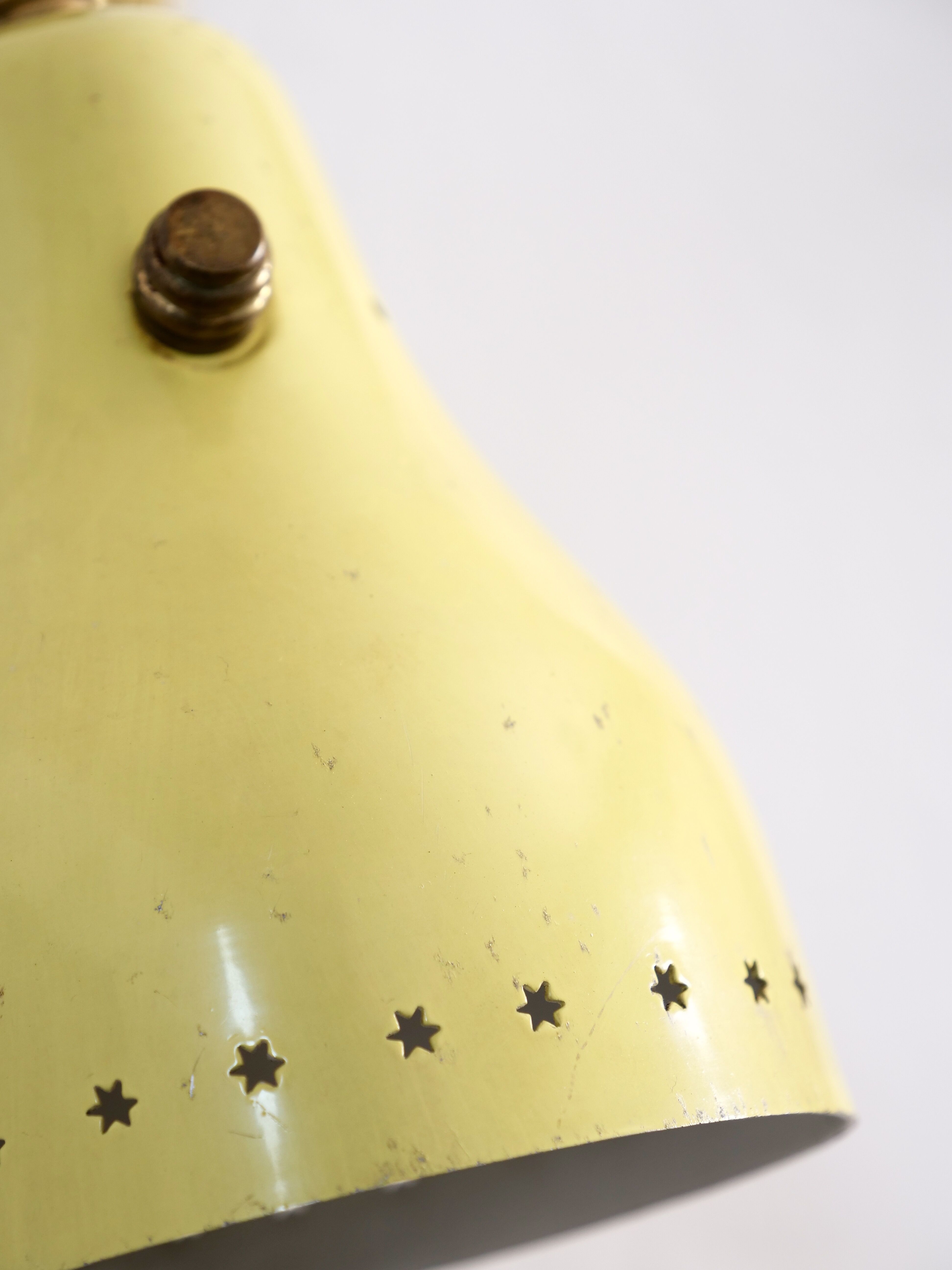 Wall lamp inlaiton and pale yellow lacquered metal