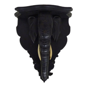 Fifth wheel, plant door, wall statue door, blackened wooden elephant head sconce. Late nineteenth century