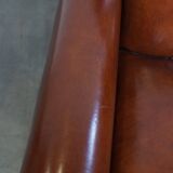 Very beautiful complete set consisting of a sheepskin leather sofa and two armchairs in cognac color
