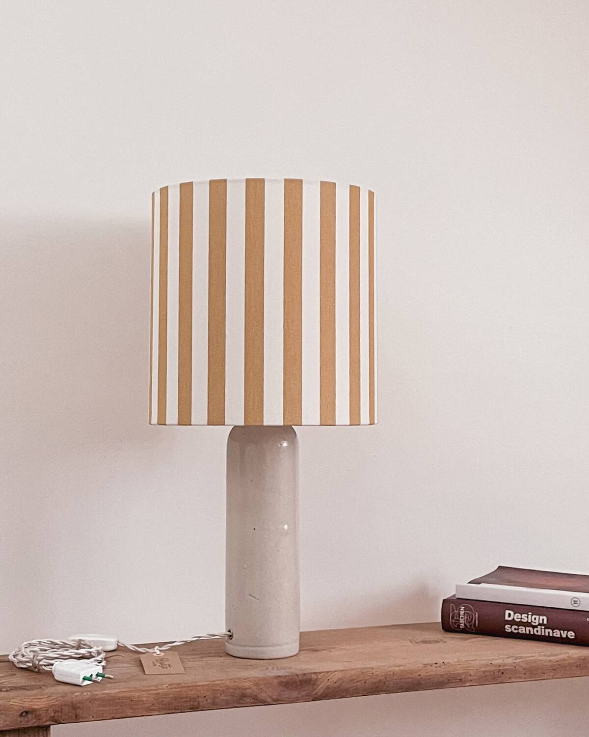 Sandstone lamp and striped lampshade