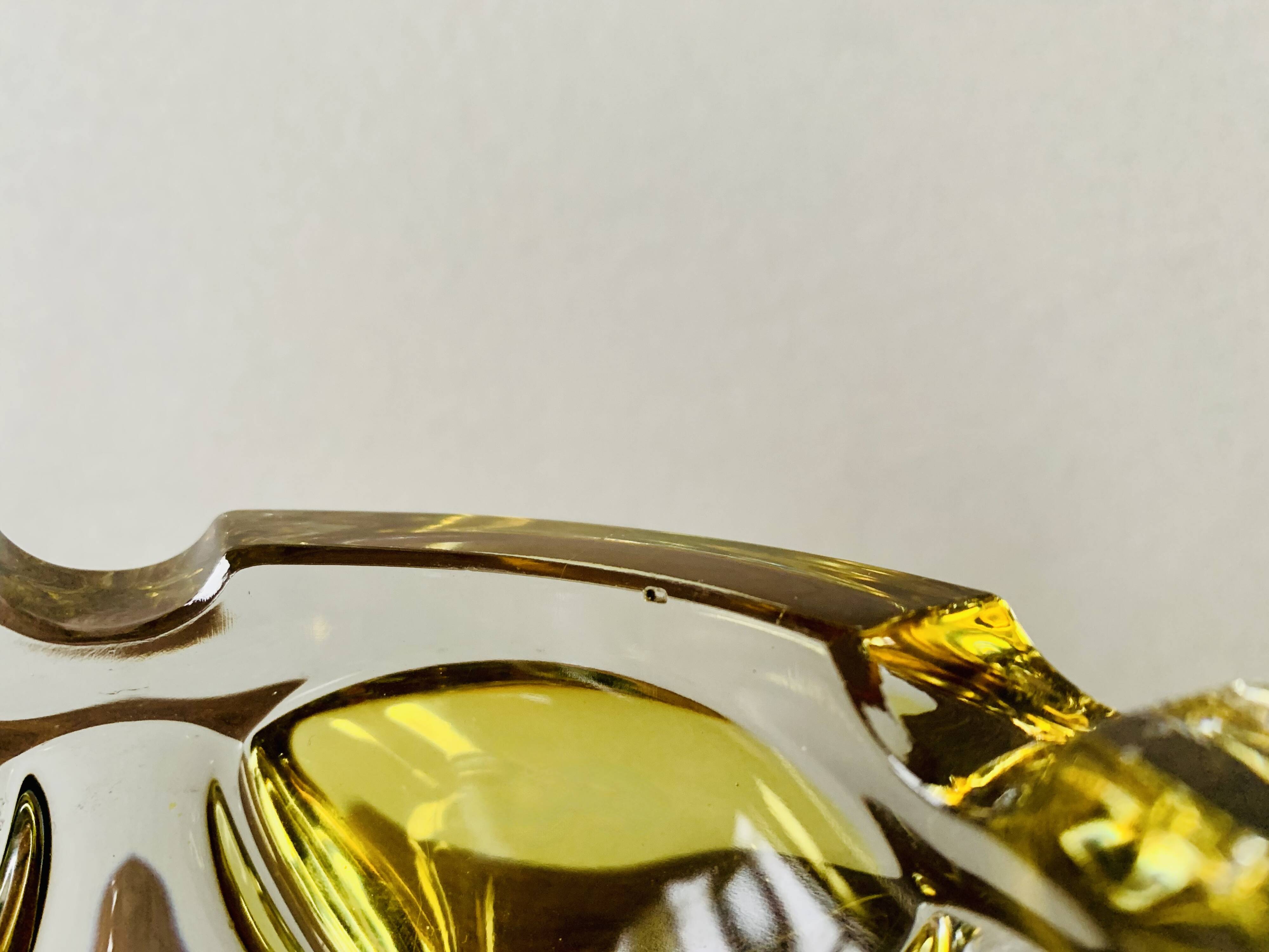 Vintage ashtray in yellow and transparent molded glass