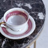 Trundle tables in imperial brown marble.