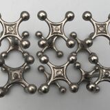 Set of 6 old table knife resistors in the shape of crossbars in silver metal