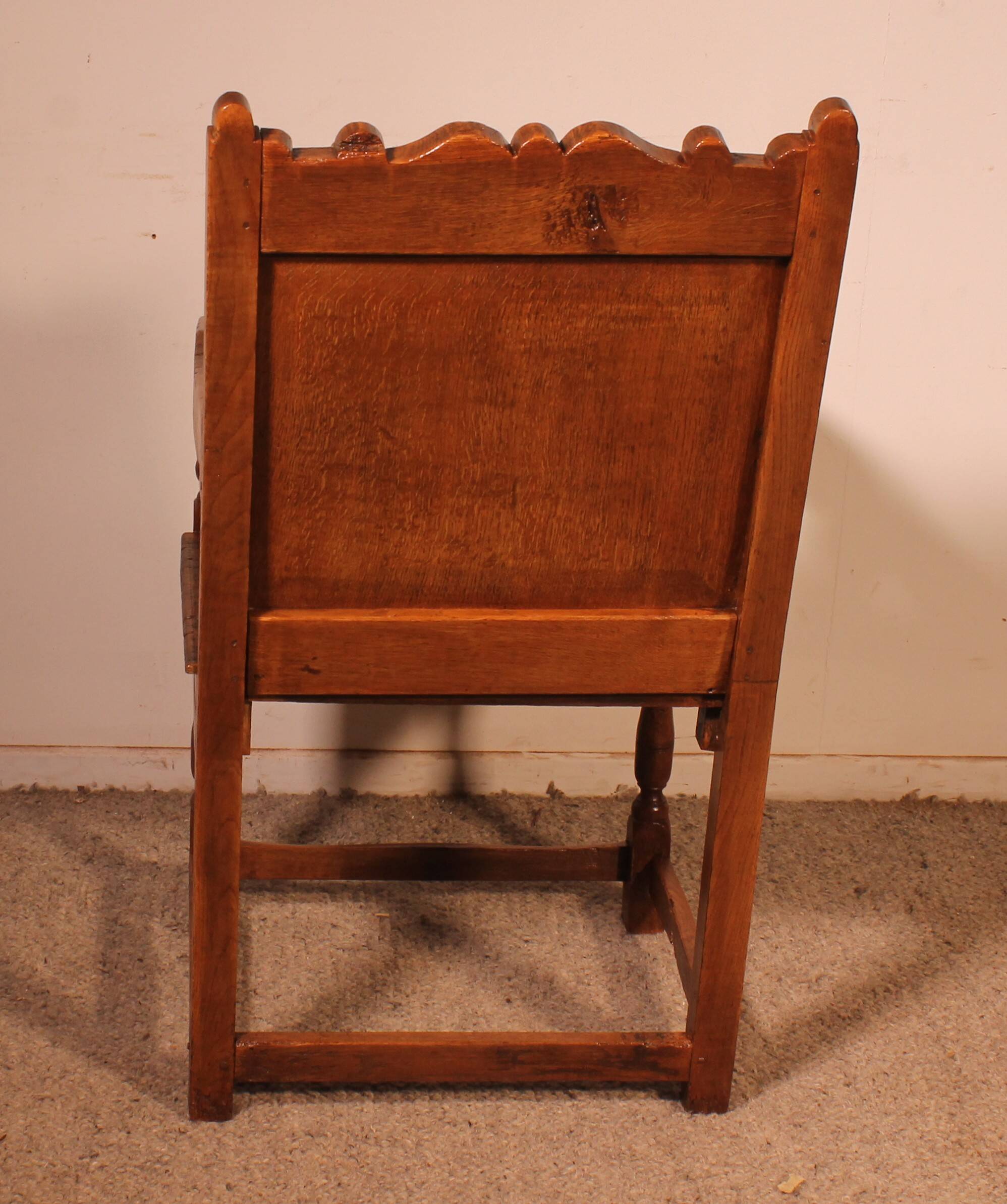 high-backed armchair from the 17th century in oak