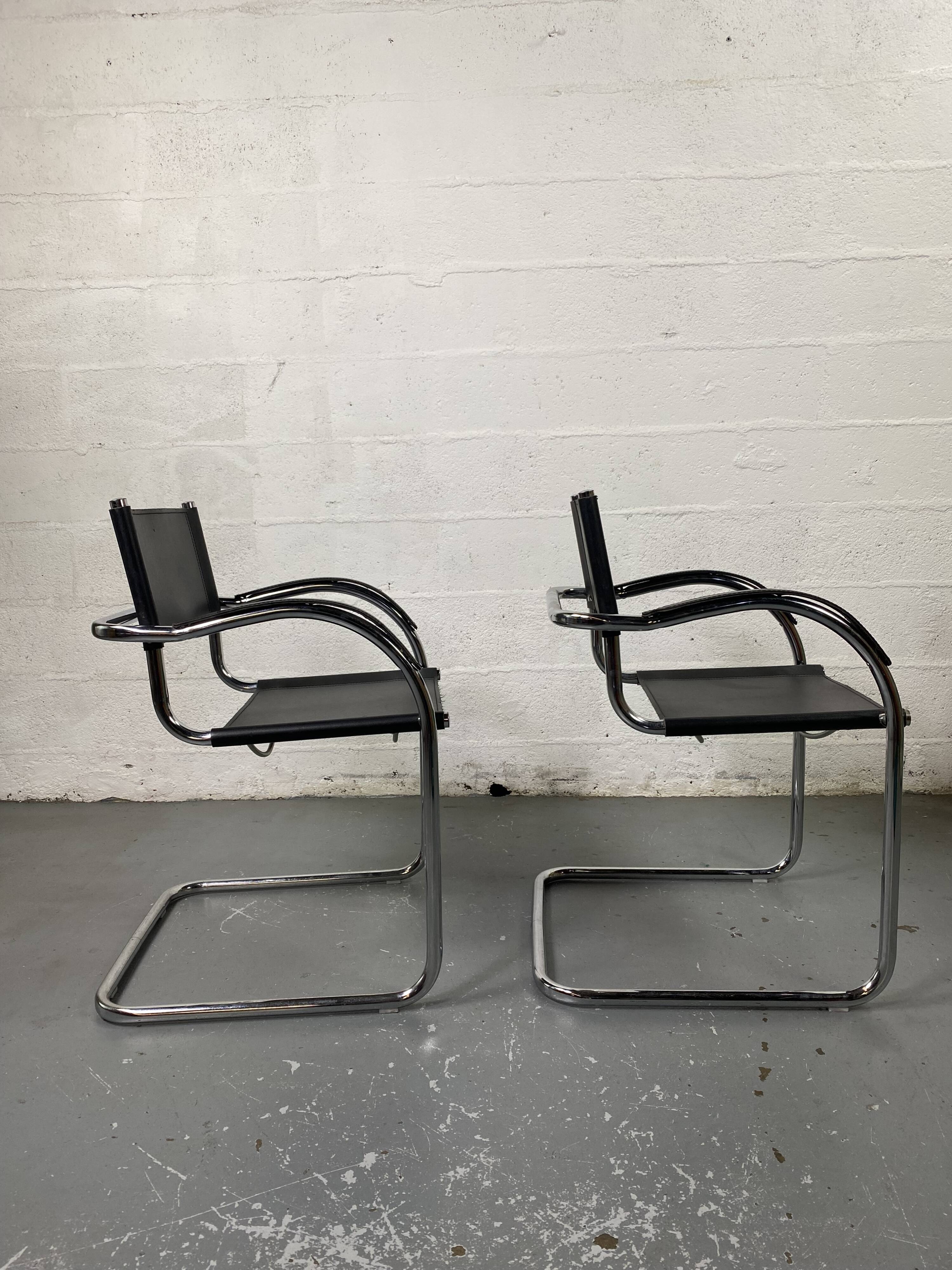 Pair of design armchairs in imitation leather chrome