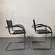Pair of design armchairs in imitation leather chrome