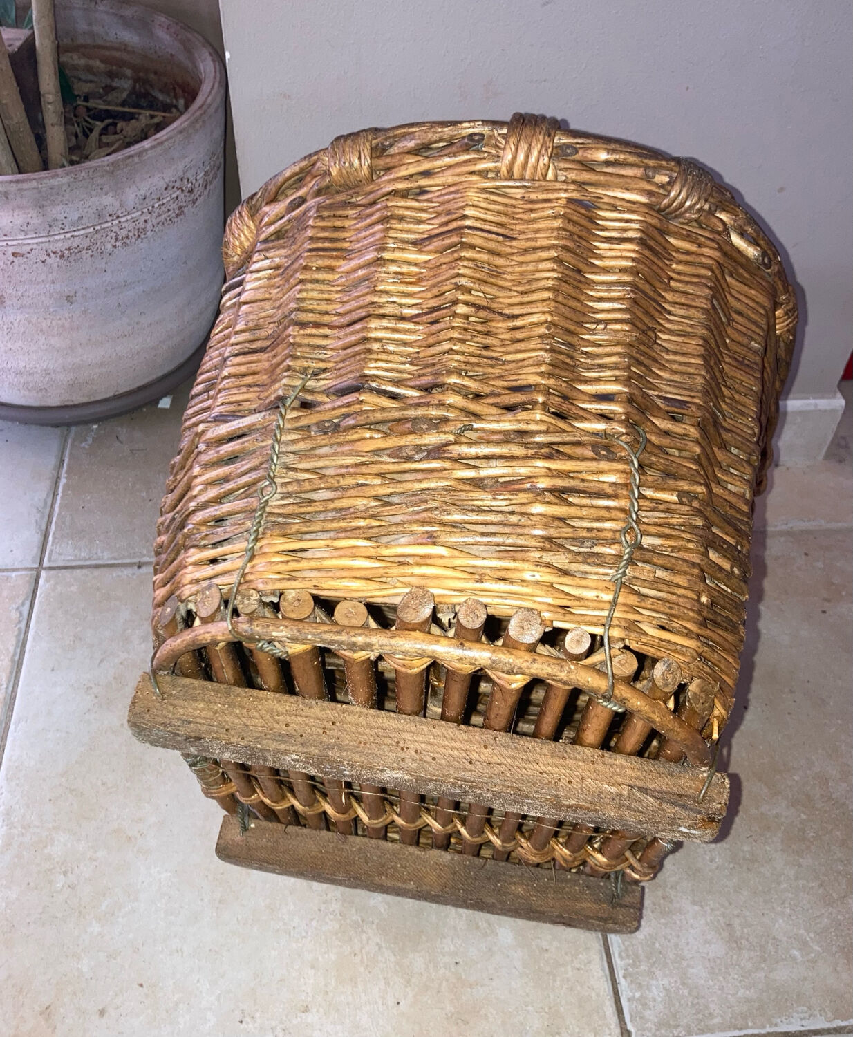 Wicker and hazel bottle basket from the early 20th century or possibly earlier.