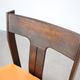 Vintage German sculptural chair from the 1970s in wood with orange faux leather.