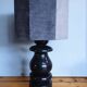 Sculptural table lamp made of turned wood